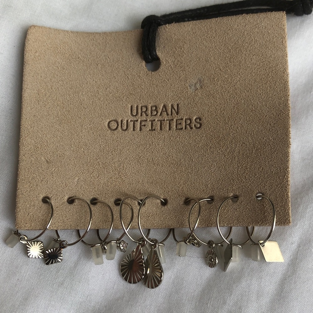 5 sets of small silver loop earrings
